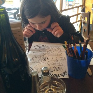 Studying the kids menu at Zenith Bar & Restaurant in St Kilda